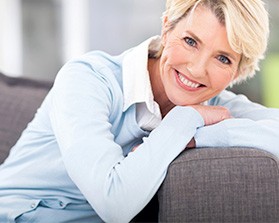  smiling older woman on couch