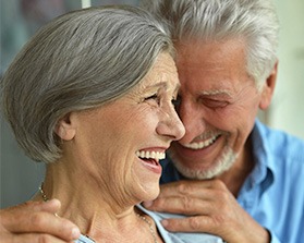 elderly couple laughing