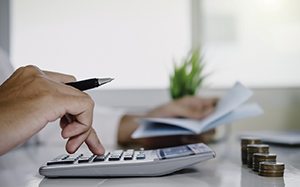 Man using a calculator