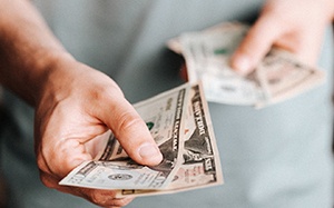 Man holding cash for payment