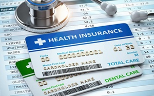 Health insurance card next to stethoscope