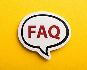 Invisalign in Bothell FAQ sign on yellow background