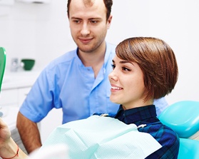 Woman looking at smile in mirror