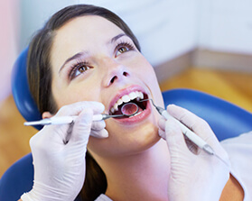 woman getting oral canccer screenings
