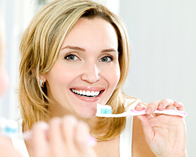 woman brushing teeth