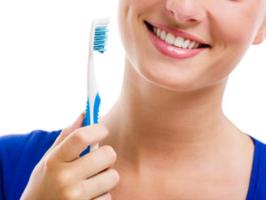 woman holding a toothbrush