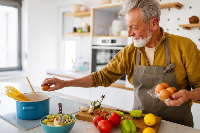 Dentures patient cooking food